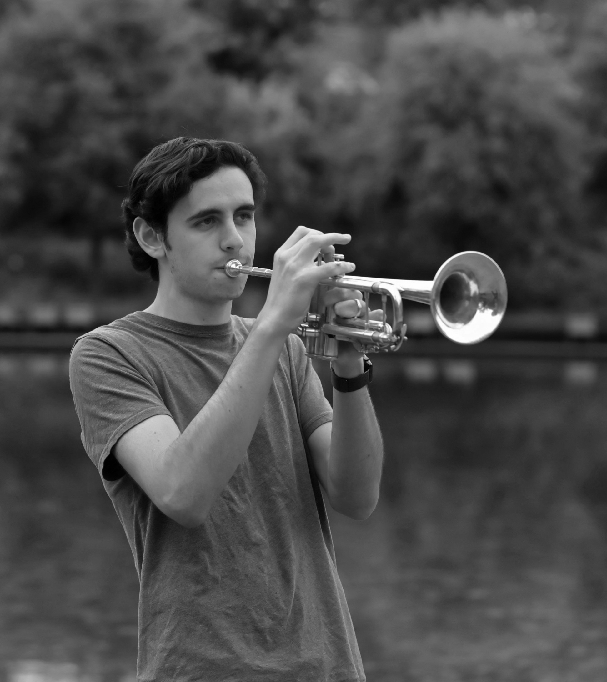 Anthony playing trumpet outdoors